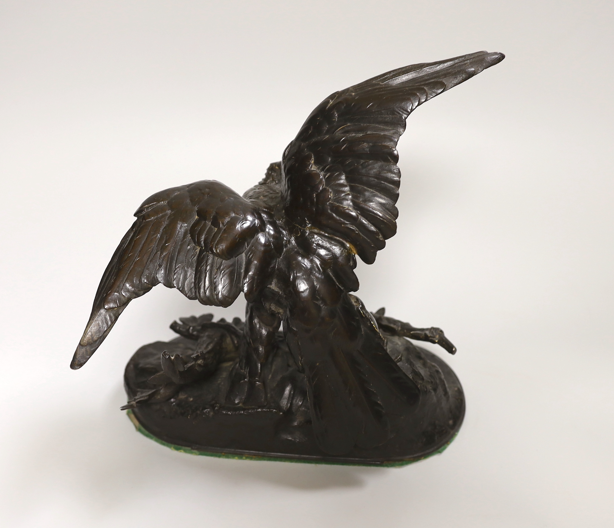 After Jules Moigniez (1835 - 1894), French bronze study of an eagle on a branch, signed, 23cm high